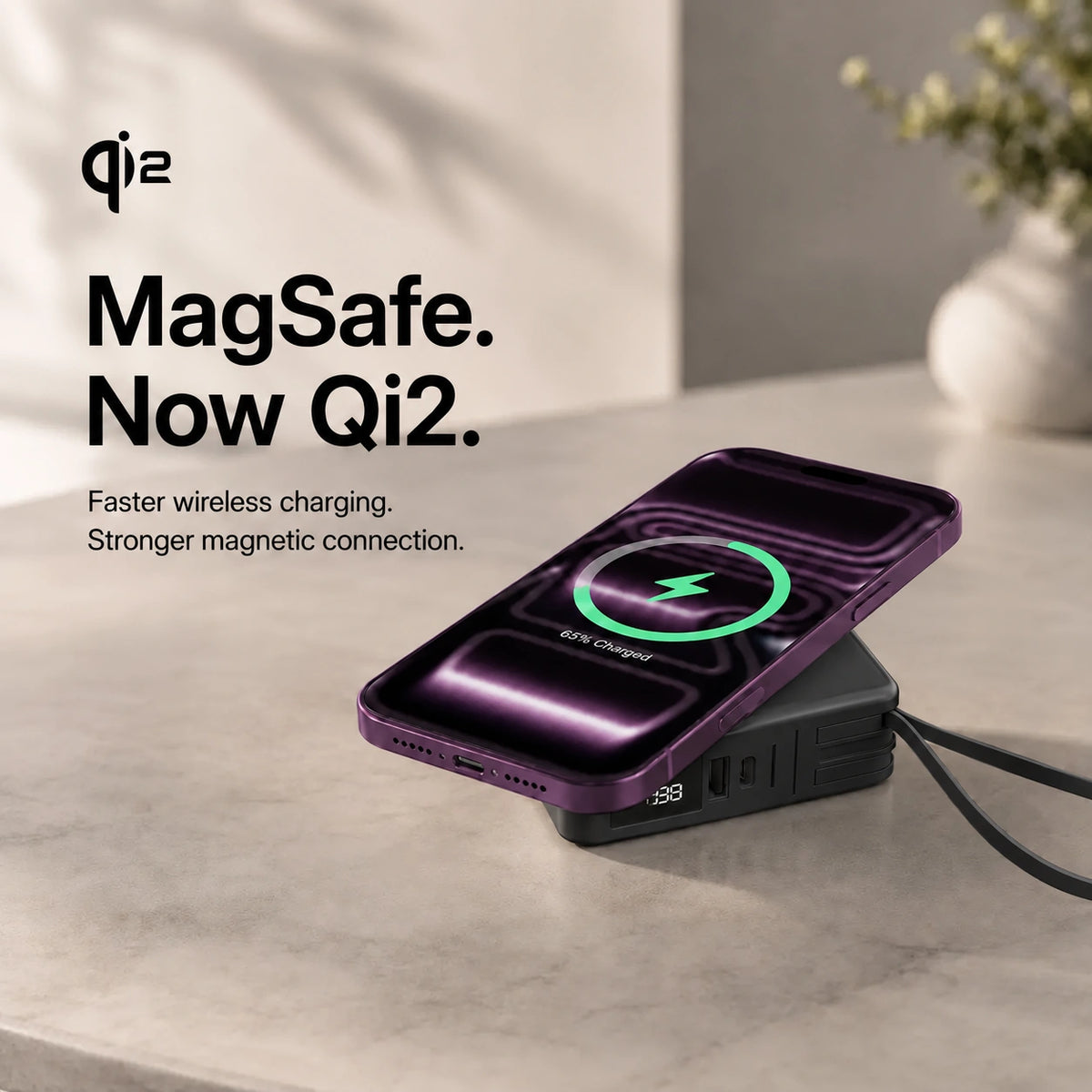 Midnight Black travel power bank charging a Burgundy phone magnetically. #color_Midnight Black